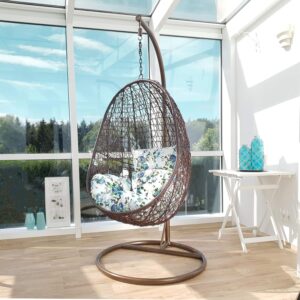 Fauteuil suspendu Kideo fleuri - Polyrotin marron et blanc avec armature - Coussins turquoise à motif floral - Balancelle lounge pour salon
